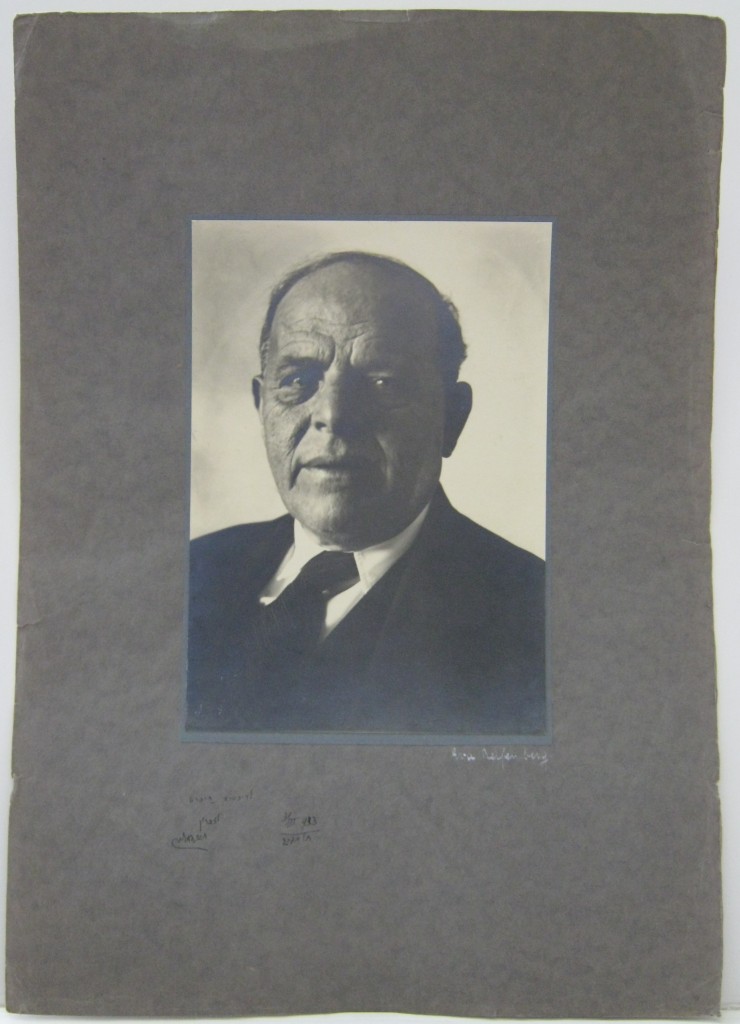 (JUDAICA.) BIALIK, HAYYIM NAHMAN. Photograph Signed and Inscribed, in Hebrew, bust portrait by Eva Riefenberg, showing him looking into